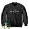 YOU’RE ON LOOTED LAND Sweatshirt